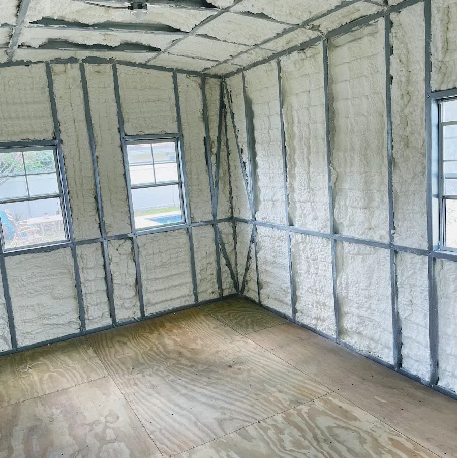 Closed-cell spray foam insulation applied to wall cavities in a residential project in Marathon